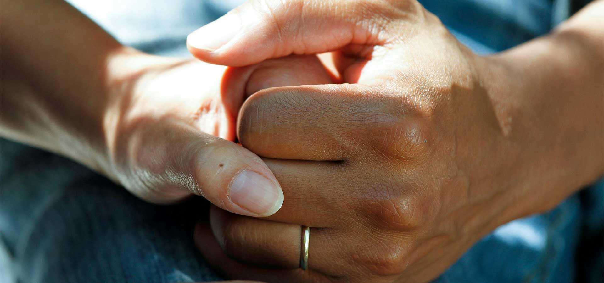 Elderly person and care professional in a calm healthcare setting